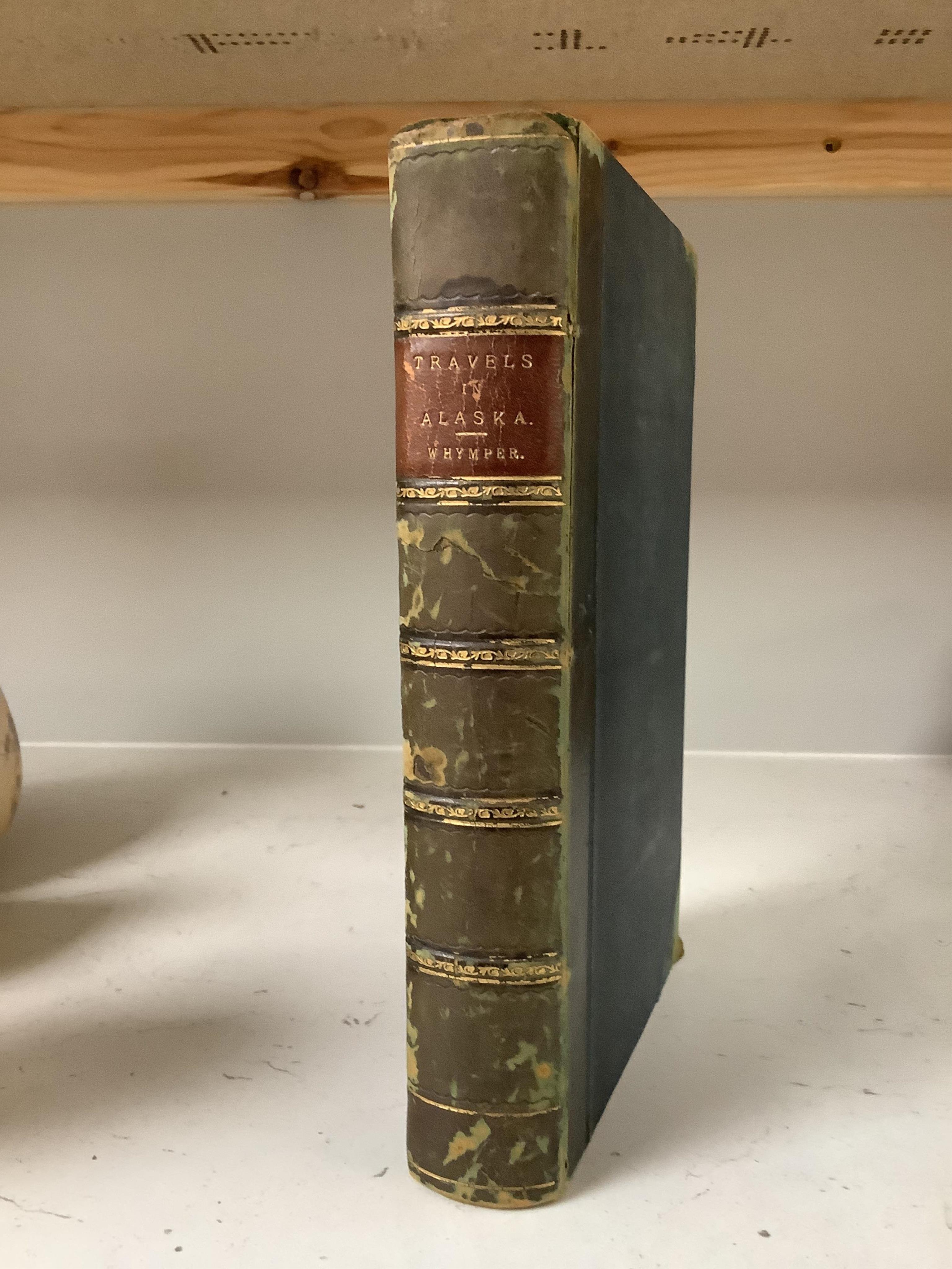 Whymper, Frederick - Travel and Adventure in the Territory of Alaska ... and in other parts of the North Pacific. folded map, 16 plates and text illus.; contemp. half calf and cloth, gilt panelled spine with red label. 1